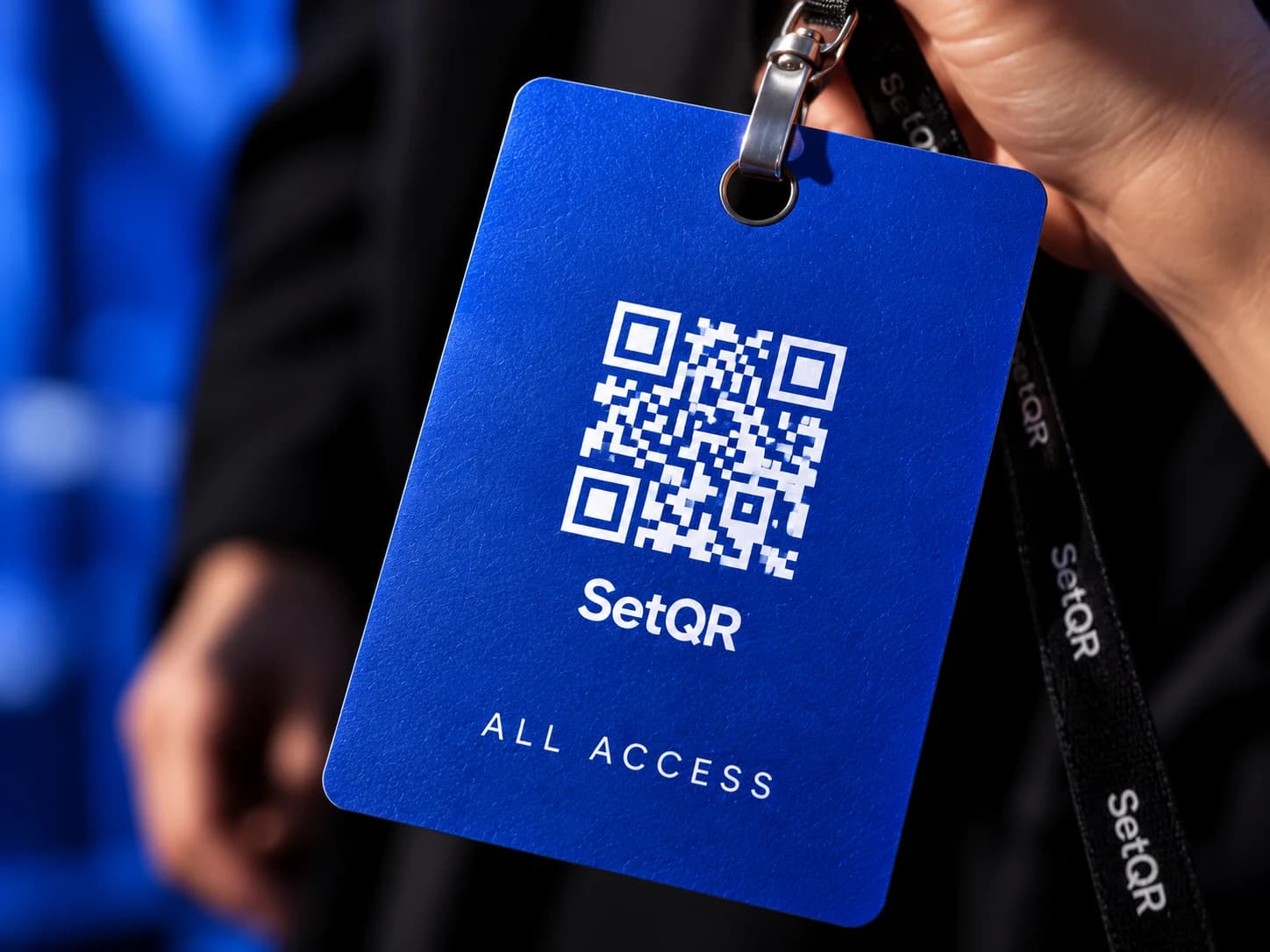 A cobalt event pass with a QR code and an All Access label.