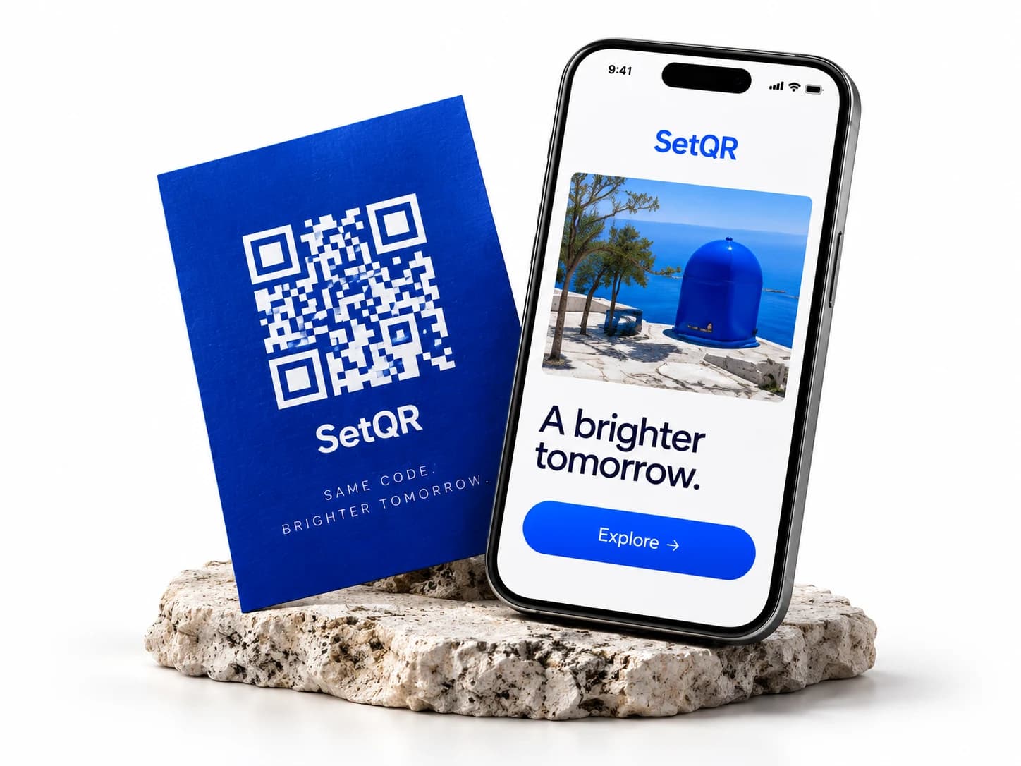 A printed blue QR card beside a phone showing the linked website.